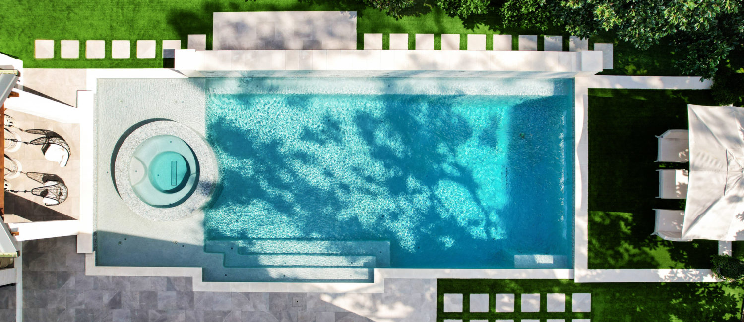 Houston home listing 802 E. Friar Tuck Lane boasts a resort-worthy swimming pool and outdoor living spaces. (Photo by TK Images)