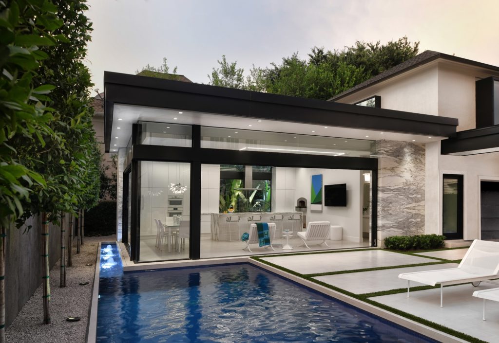 The 3,000 square foot cabana, pool terrace, and guest suite in River Oaks was designed by Gary R. Chandler Architecture with interior design by Paula Fyhr Designs, landscape architecture by Design: Exterior Worlds. (Photo by Miro Dvoracak)