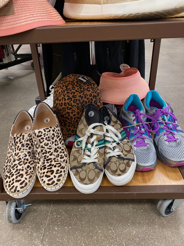 Never worn designer sneakers on sale at the Salvation Army Auxiliary Reflections on Style Chic Boutique
