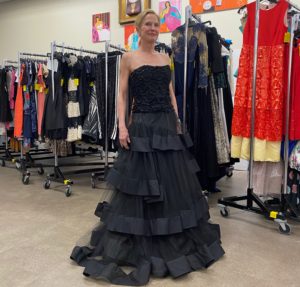 Salvation Army Auxiliary Reflections on Style Chic Boutique co-chair Pam Sengelmann models one of many stunning gowns on sale when doors open on the evening of April 14.