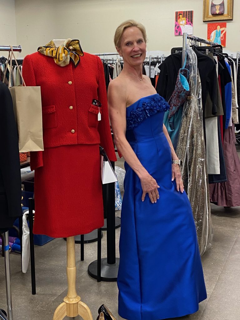A vintage Chanel suit and beautiful ballgown, worn by Salvation Army Auxiliary Chic Boutique co-chair Pam Sengelmann.