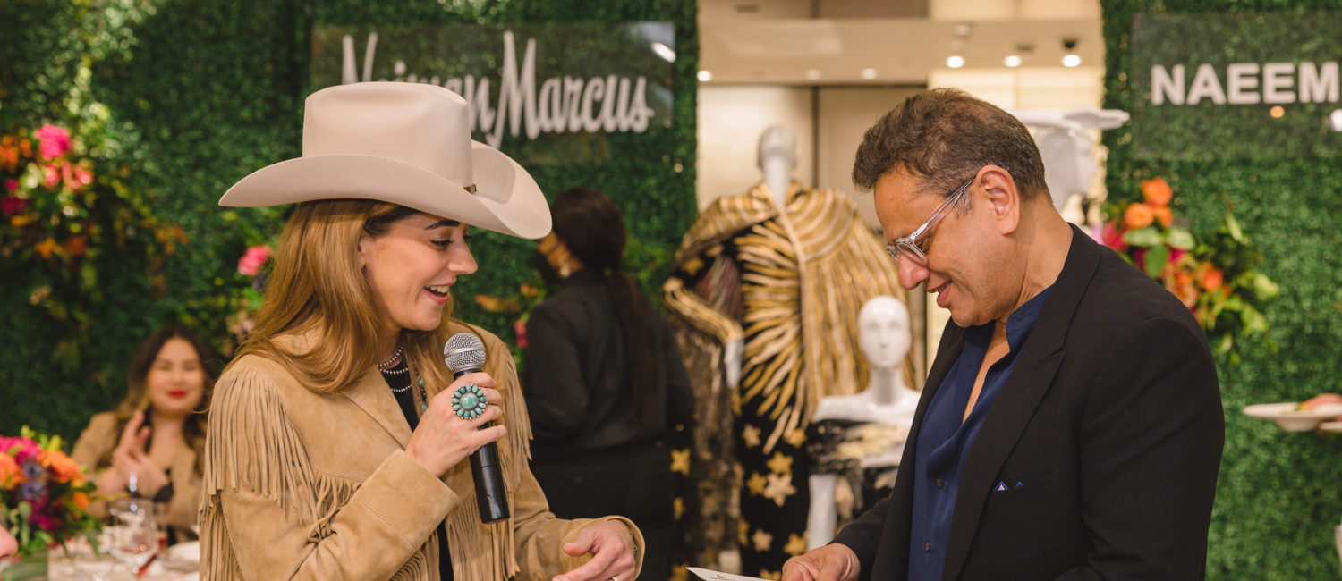 Kristina Somerville presenting Naeem Khan with Rodeo Tickets at Neiman Marcus luncheon