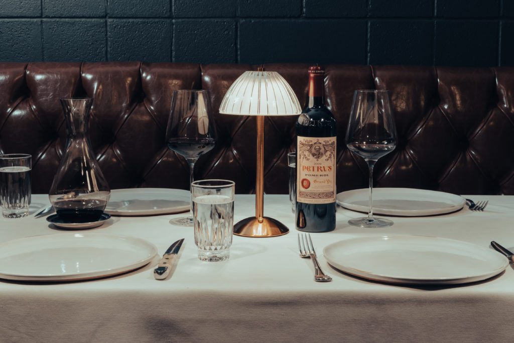 A candlelight table in the new hideaway steakhouse in the Heights, Patton's. Photo by Barrett Doke