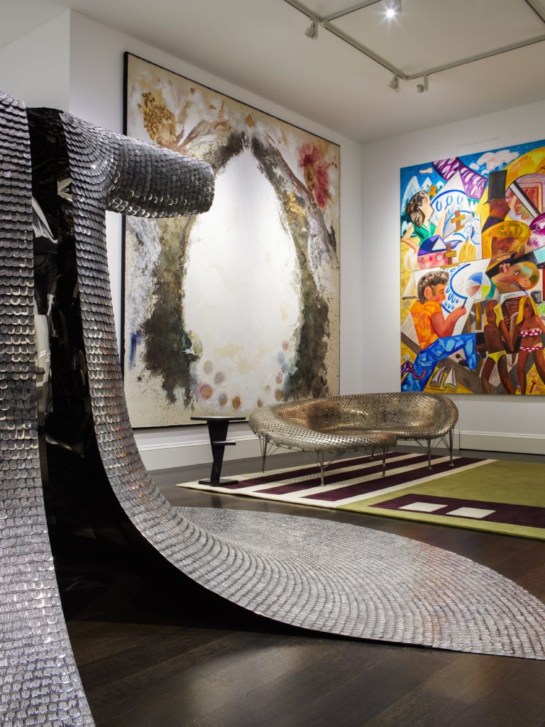 At Rowdy Meadow designed by Peter Pennoyer, Johnny Swing’s "All the King’s Men," a sofa designed in 2010, sits next to an eggshell and black lacquer side table from Dune and under Lucy Dodd’s "Egg" (2017) and Dana Schutz’s "Assembling an Octopus" (2013). The rug, A-Z Carpet Furniture: Office, was designed by Andrea Zittel (2008). 

