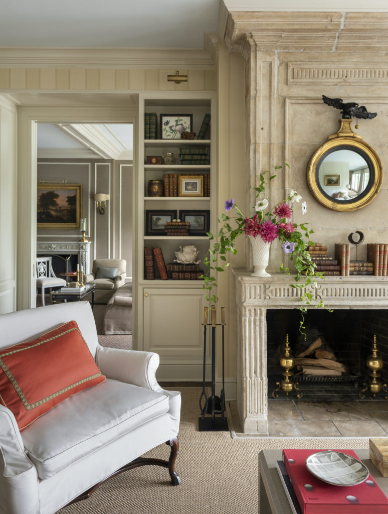 An English Regency mirror introduces a note of elegant whimsy. An extra-wide
chair is a comfortable place to lounge and chat while meals are being prepared.