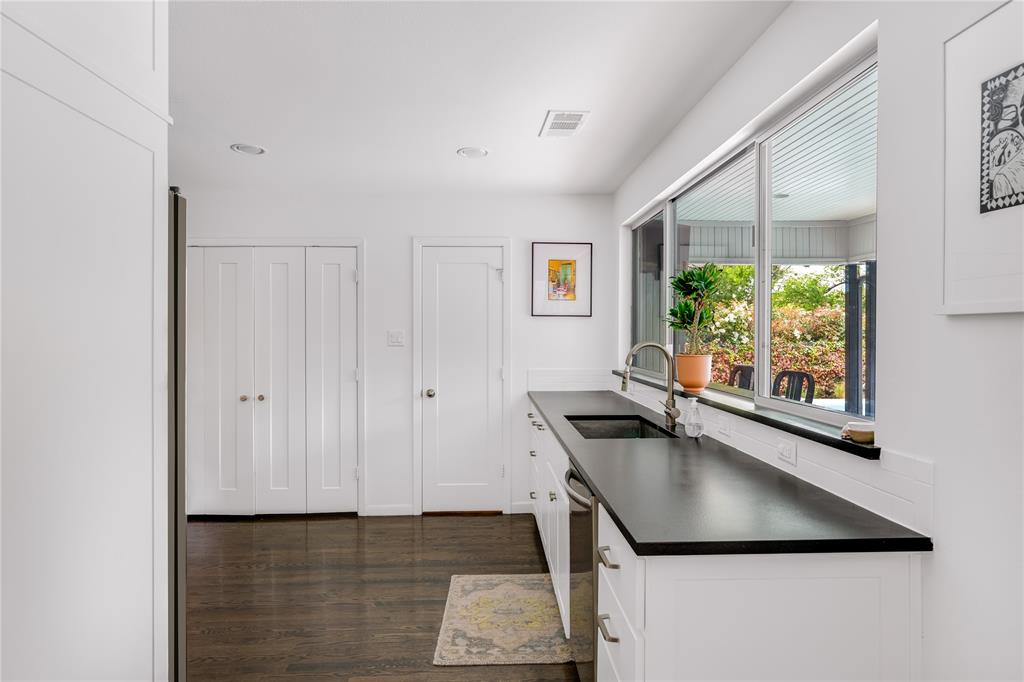 Glimpse the charming backyard while you cook. 