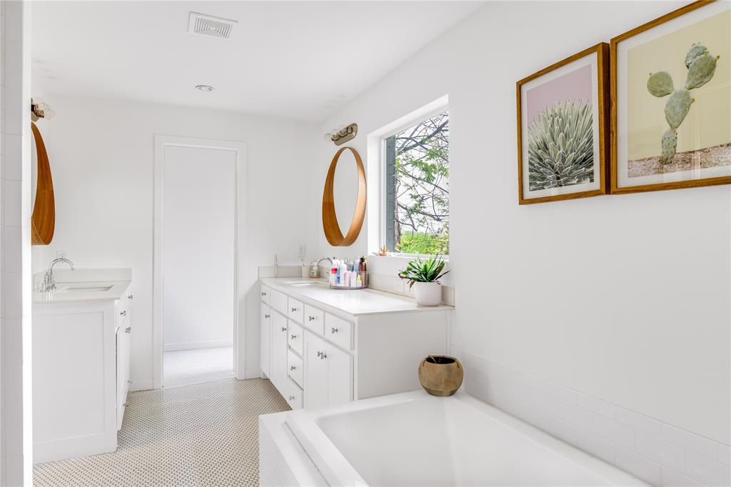 The all-white, ensuite master bathroom. 
