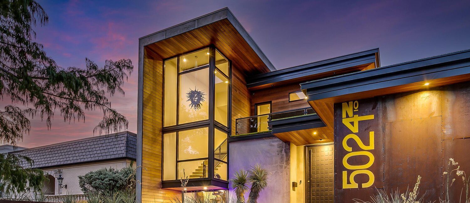 5024 Bryce – Clad in concrete and weathering steel, this home make a dramatic statement