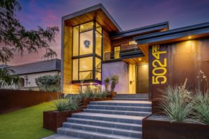 5024 Bryce – Clad in concrete and weathering steel, this home make a dramatic statement