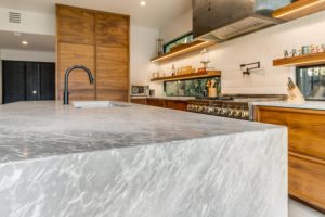 5024 Bryce – The center island is part function and part fantasy with its leathered granite waterfall edge.