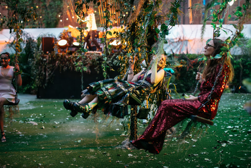 Guests using the party's custom-built swing set (Photo by Beckley & Co)