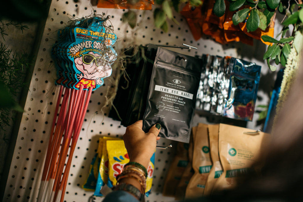 A rundown bodega stocked with dozens of branded snacks and drinks  (Photo by Beckley & Co)