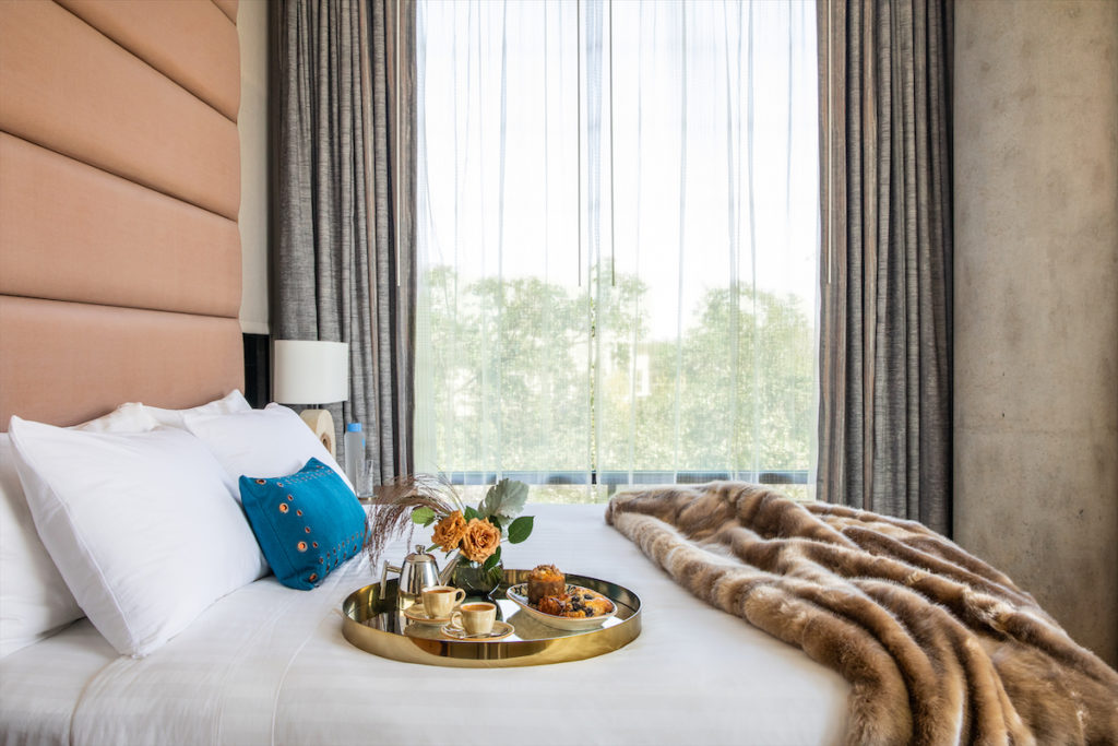 A room at the Drey Hotel, The Village's on-site boutique hotel.