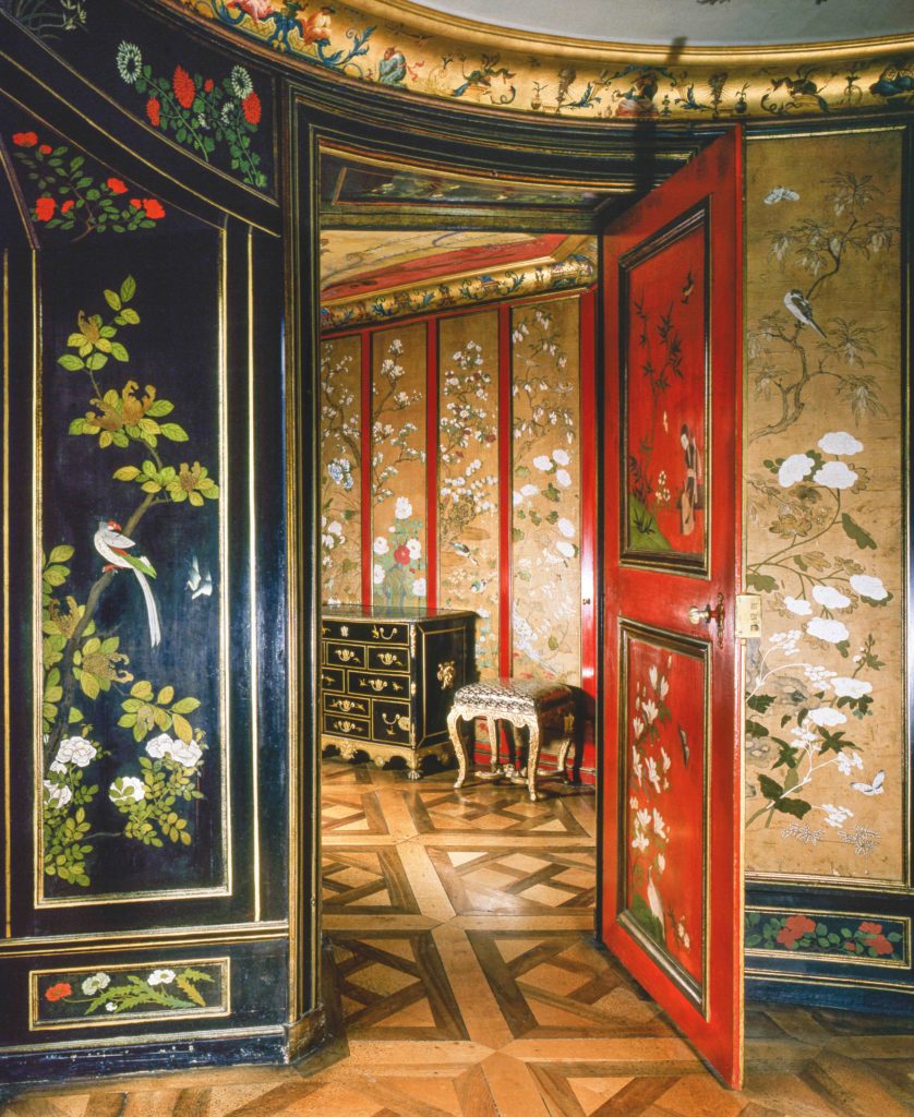 The Chinese Cabinet seen from the Chinese Drawing Room in the Pagodenburg, a small chinoiserie lodge on the grounds of the
Nymphenburg Palace, Munich. In the upper chambers are panels of black and red lacquer with imported Chinese wallpaper