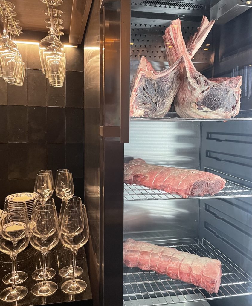 Prime cuts of beef aging gracefully in the cooler. Photo by Courtney Dabney.