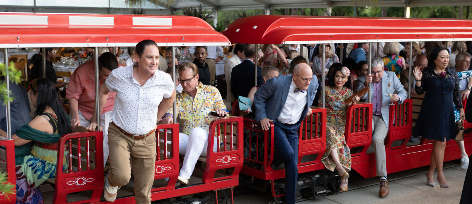 The Hermann Park Railroad delivers guests to the Molly Smith Plaza for cocktails before dinner at the tented 'Evening in the Park' fundraiser. (Photo by Daniel Ortiz)