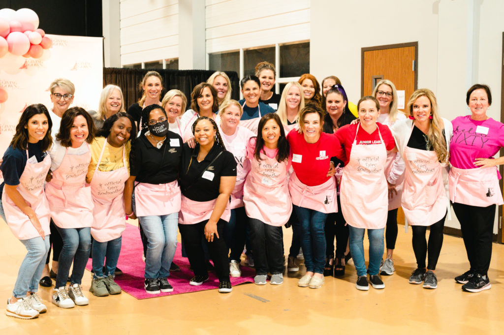 The Giving Gown Foundation volunteers pose for a group photo. (Photo by Sara Blair Design Photography)