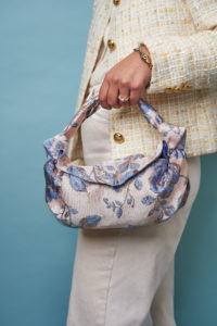 Nodo Mini Clutch in Rose Gold on model-front (Photo by Photography courtesy of RAGDOLL PR)