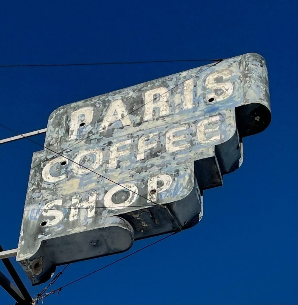 Paris Coffee Shop signage is being restored with neon.