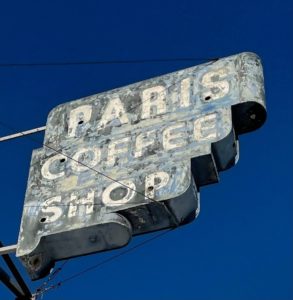 Paris Coffee Shop signage is being restored with neon.