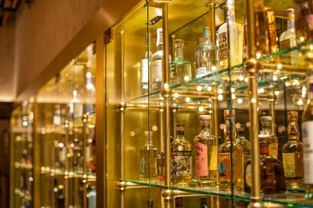 The Mexican's backlit tequila wall features hundreds of top-shelf bottles. 