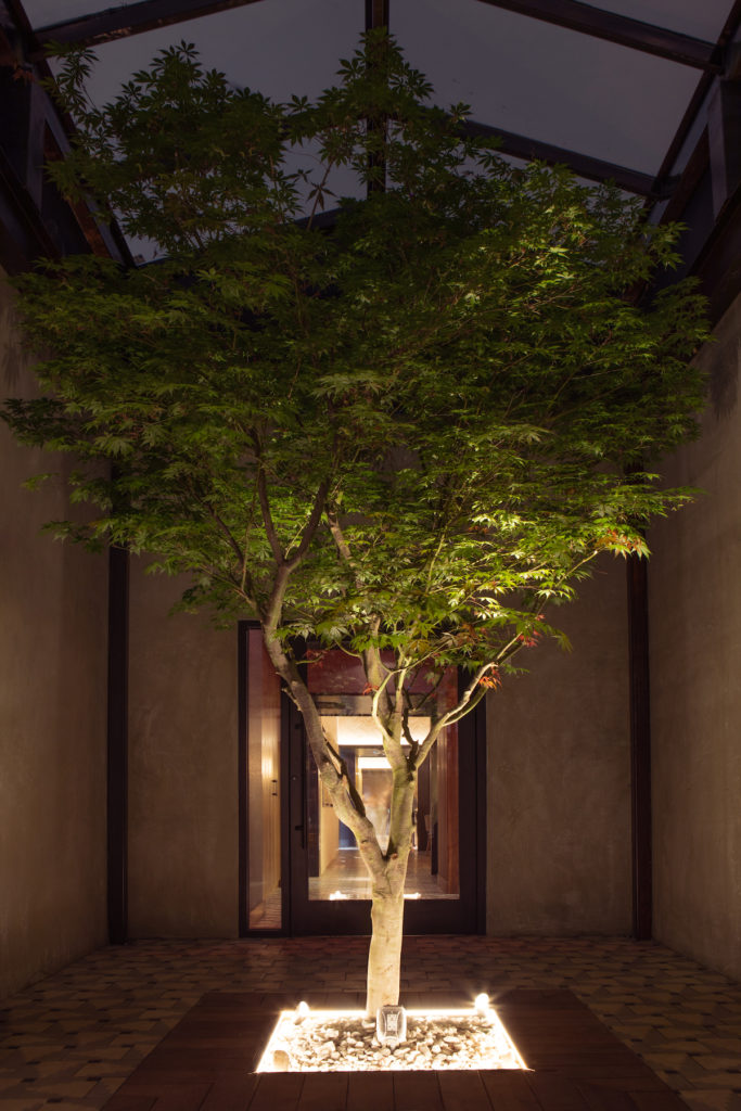 A courtyard moment lights the way to coveted patio spots. 