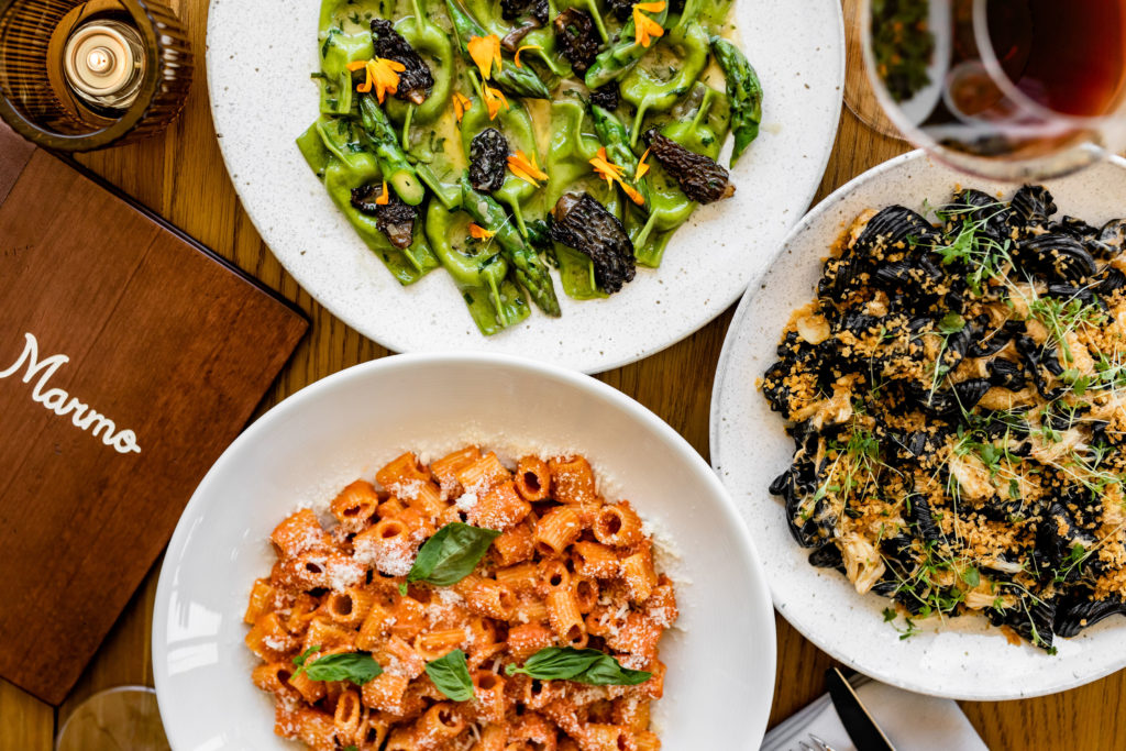 Freshly made pastas are served by the half and full portions at Marmo. Pictured from top- Scarpinocc, a ricotta-filled pasta, Right: Squid Ink Campanelle, Bottom: Rigatoni alla Vodka. (Photo by Kirsten Gilliam)
