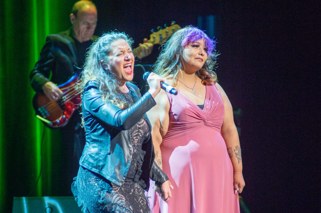 Laurel Harris performing “Defying Gravity” with Covenant House Texas youth resident Anni during the Night of Broadway Stars fundraiser (Photo by Jacob Power)