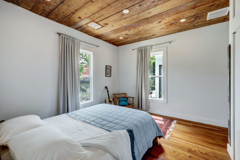 Original flooring and ceilings are preserved in the secondary bedrooms in the house at 717 East 21st St. in The Heights  (Photo by TK Images)