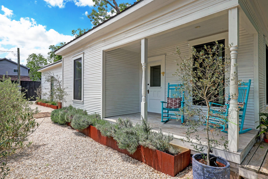 The charming front porch at 717 East 21st St. in The Heights (Photo by TK Images)