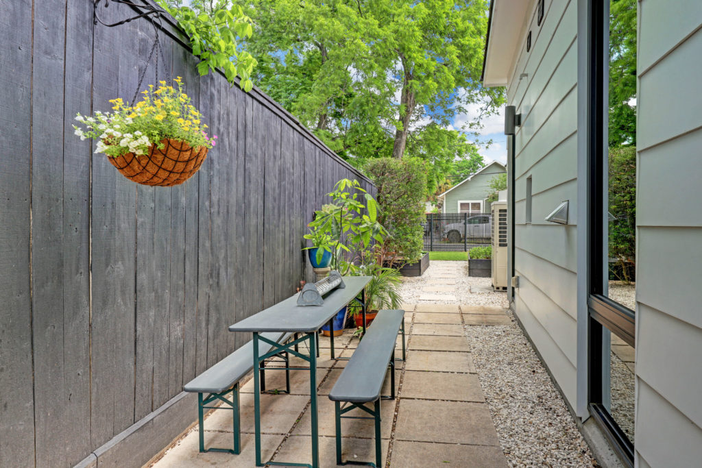 Side yards at 717 East 21st St. are covered in white limestone gravel (Photo by TK Images)