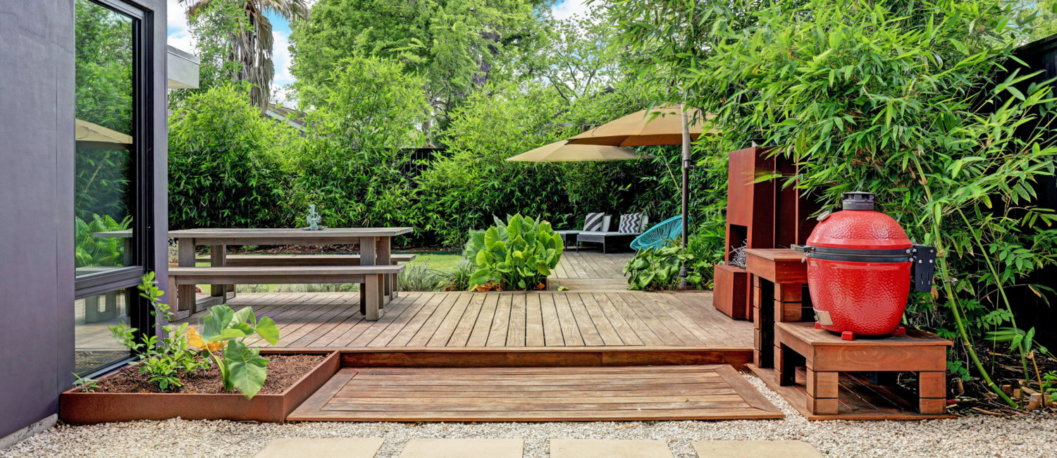 Lush gardens and decking await 717 East 21st Street in The Heights. This is no ordinary Heights bungalow. (Photo by TK Images)