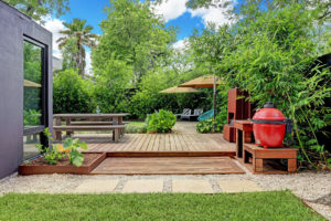 Lush gardens and decking await 717 East 21st Street in The Heights. This is no ordinary Heights bungalow. (Photo by TK Images)