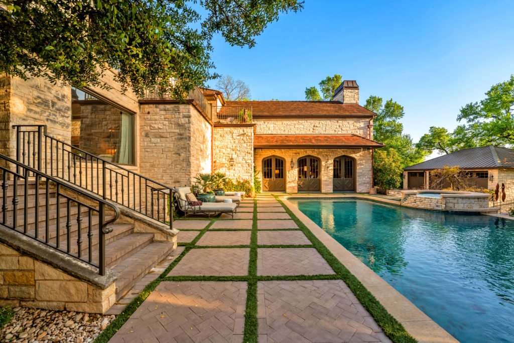 The pool and spa in the park-like backyard.