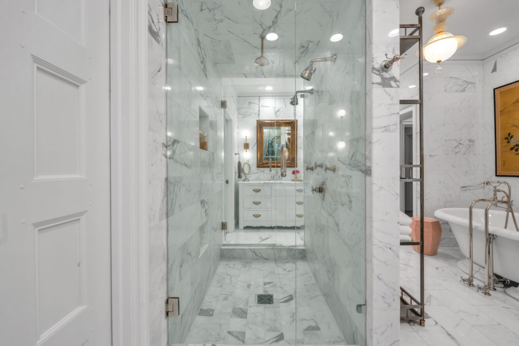 Walk through shower in his and hers bathroom.