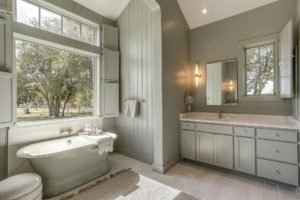 8632-S-FM-1187 – Sage green primary bath with soaking tub, shower and dual vanities.