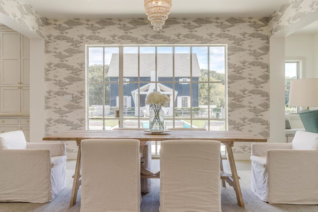 The dining room with its view to the pool and guest house beyond.