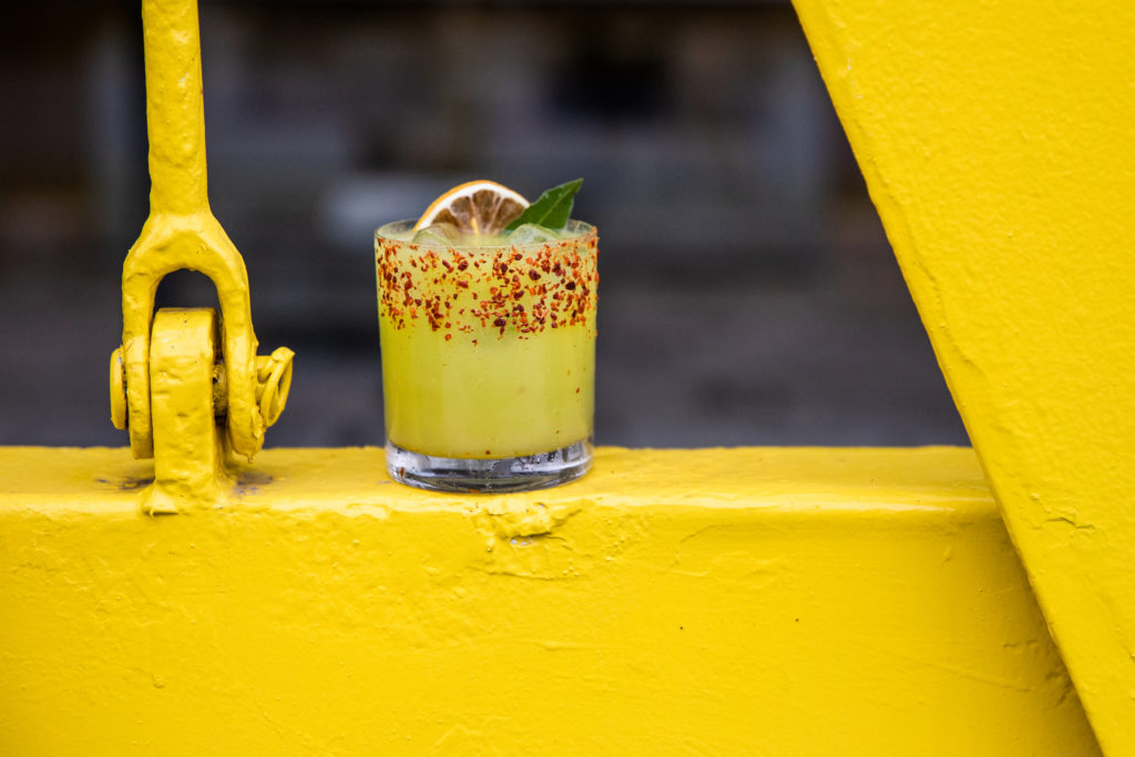 East of the Pecos,' a tequila and mezcal-based tincture, is named after the cantilevered yellow-painted steel installation by artist Rolf Westphal. (Photo by Rebecca Wright)