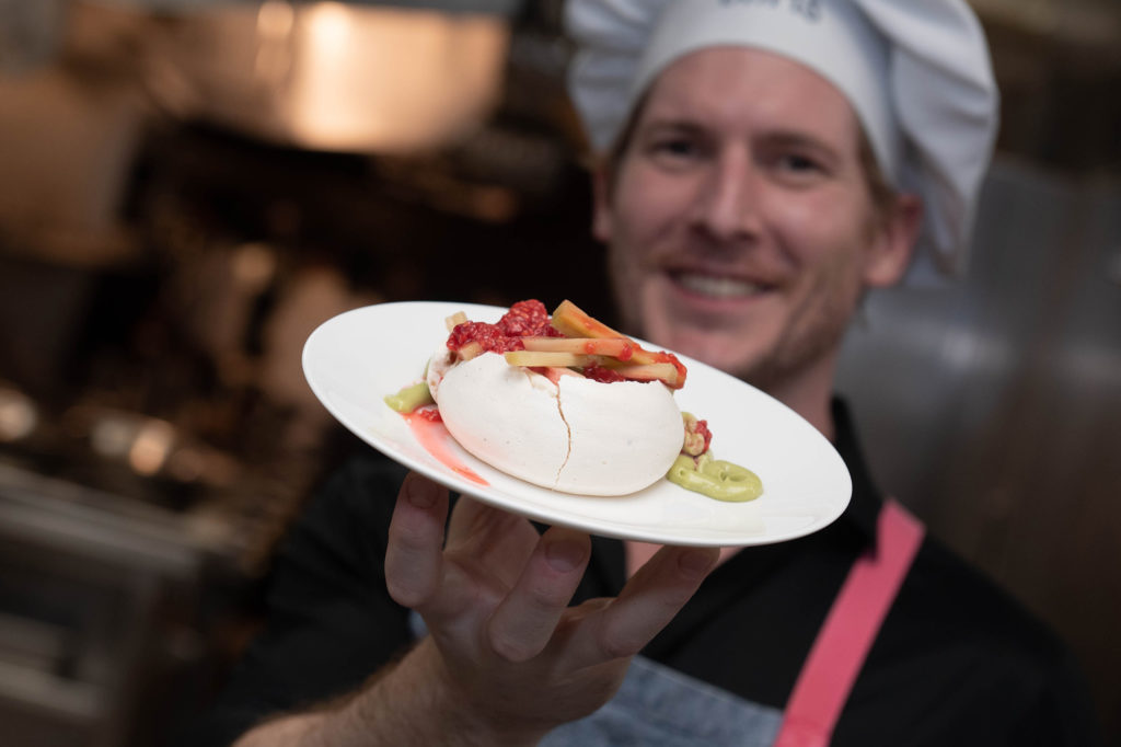 Houston Ballet soloist Christopher Commer with the dessert pavlova prepared with Fluff Bake Bar's Rebecca Masson (Photo by Wilson Parish)