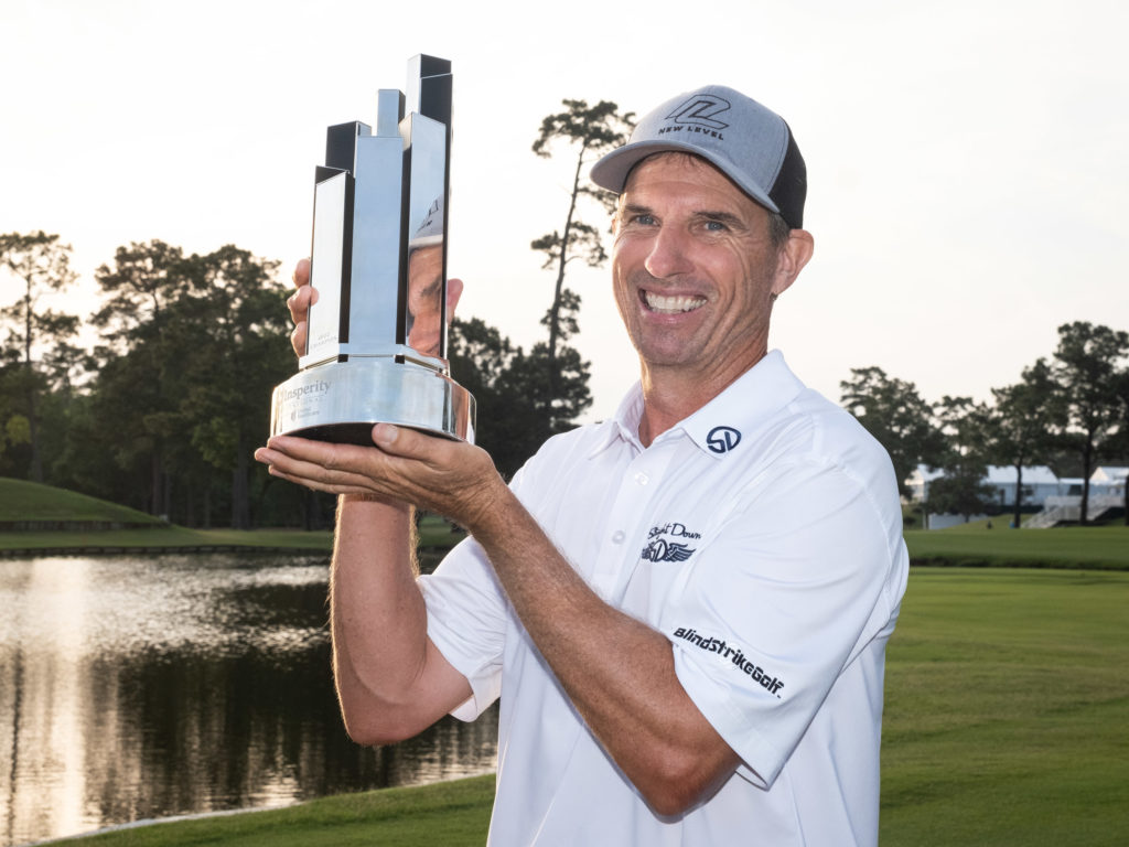 New Zealand's Steven Alker got the championship trophy at the Champions Tour event in The Woodlands.  (Photo by F. Carter Smith)
