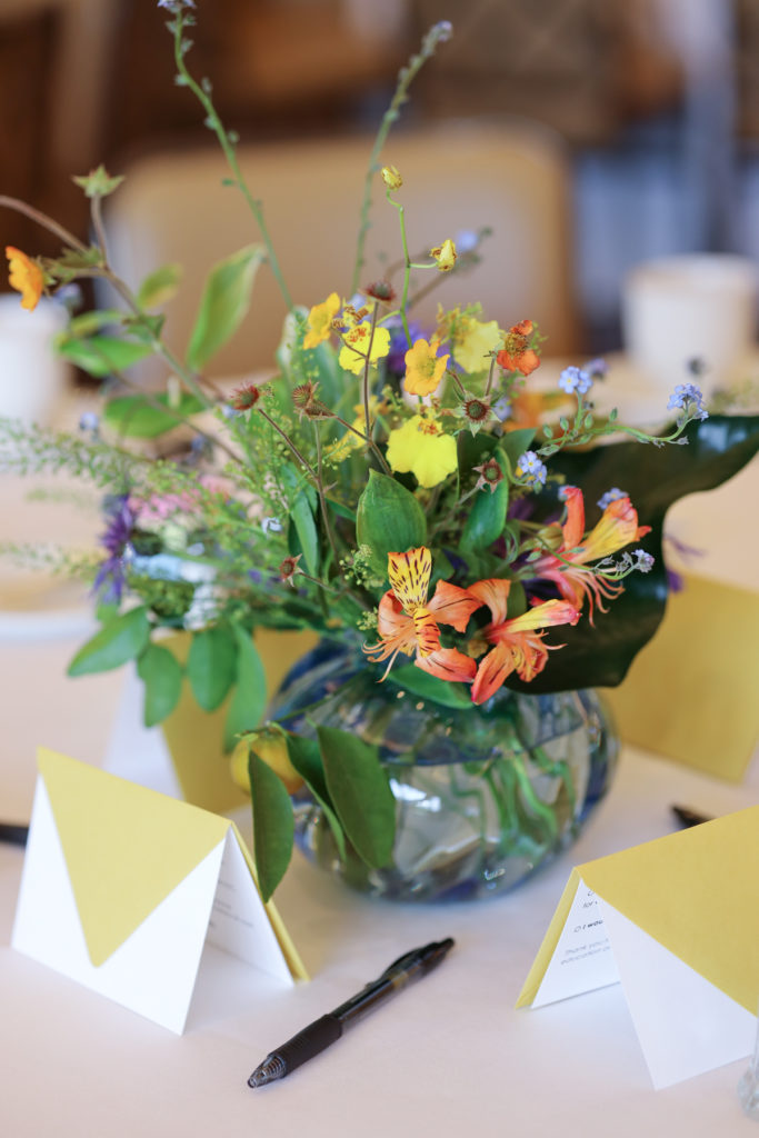 Handmade glass vases by Houston artist Eric DePan and flowers by Hannah Lowery of Edges Wild Studio were snapped up from the table centerpieces. (Photo by Katy Anderson)