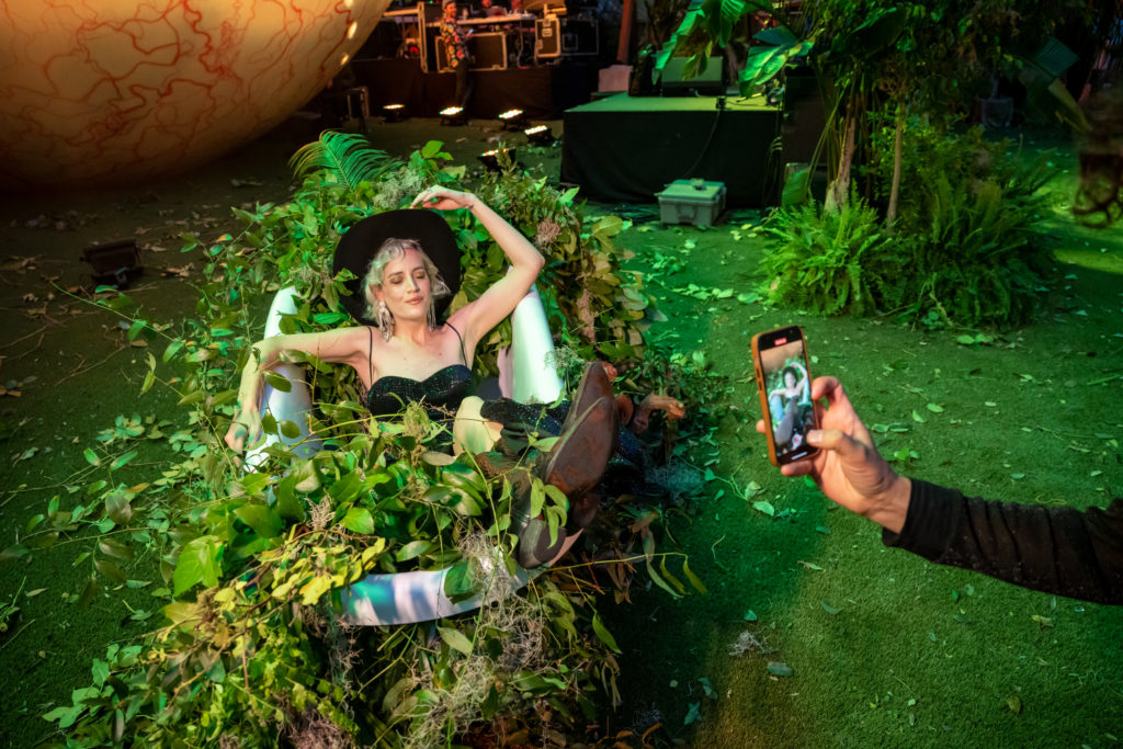 Rambo Elliot kicks up heels at The Eye Ball in the bathtub relic enveloped in vines