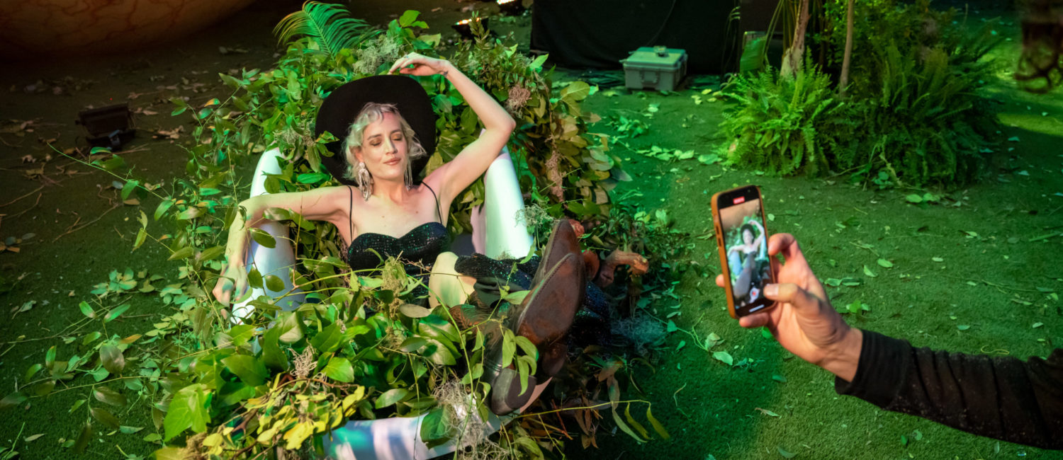 Rambo Elliot kicks up heels at The Eye Ball in the bathtub relic enveloped in vines