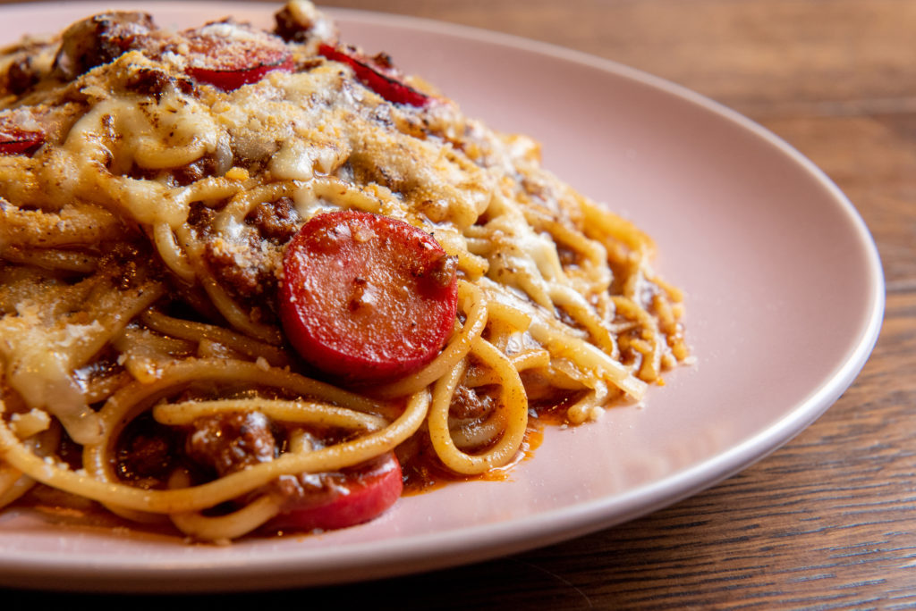Tom's Spaghetti is named for chef Tom Cunanan favorite childhood dish, spaghetti in a meat ragu with slices of hot dogs and banana ketchup. (Photo by Kat Ambrose)