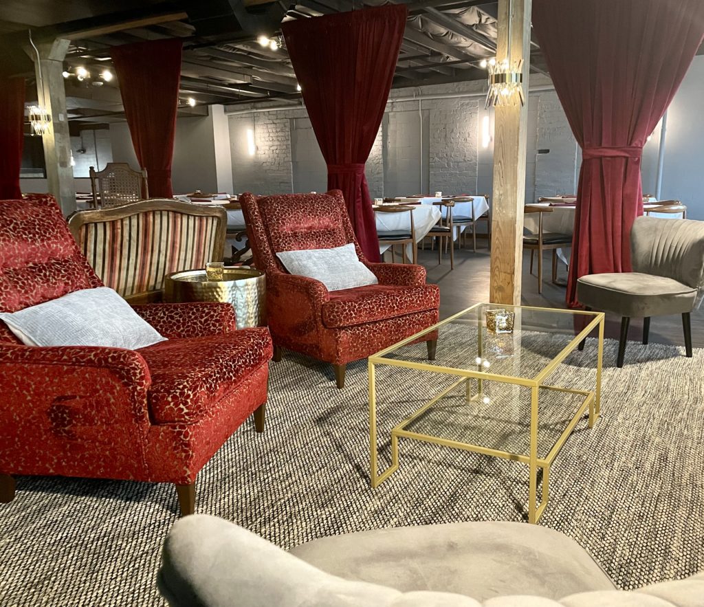Cozy lounge are upstairs, where the entire back section can be curtained off for private parties. (Photo by Courtney Dabney) 