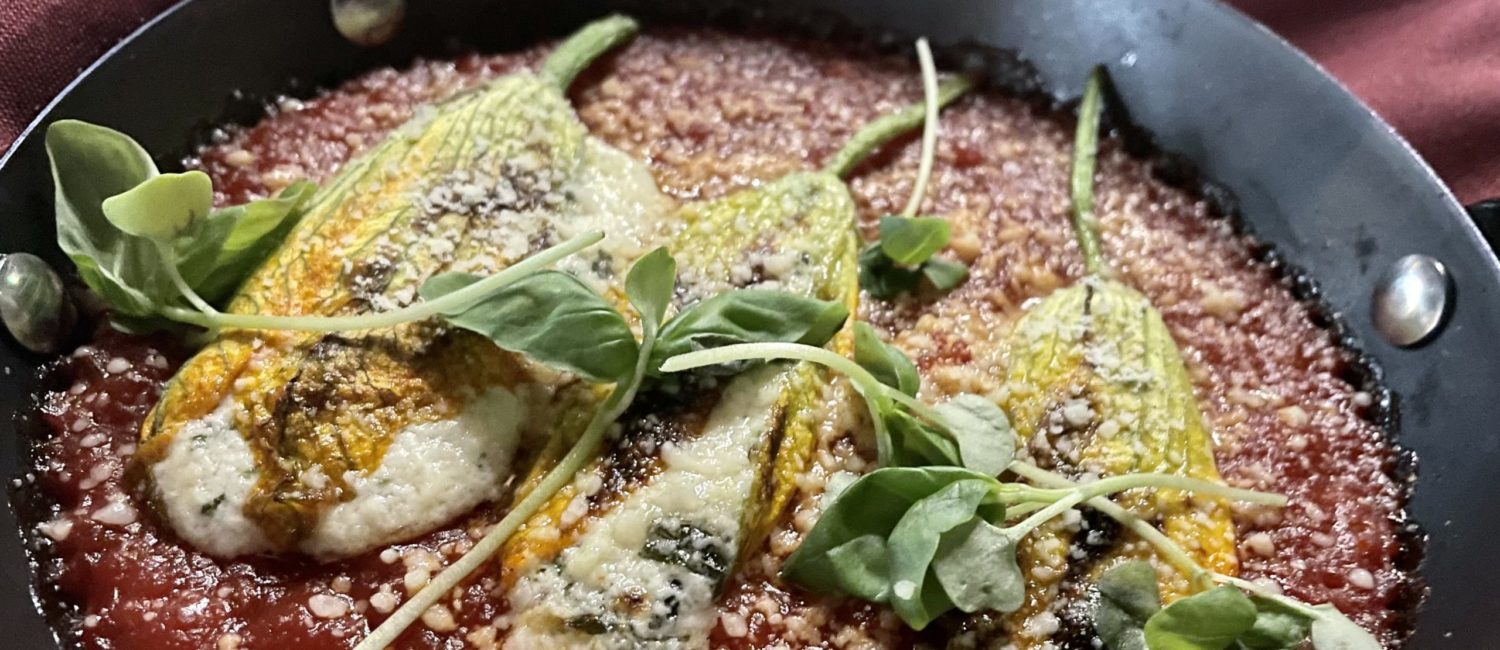 squash blossoms in arrabbiata sauce stuffed with a mixture of ricotta anchovy and pecorino are just one of the interesting Tre Mogli dishes. (Photo by Courtney Dabney)