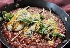 squash blossoms in arrabbiata sauce stuffed with a mixture of ricotta anchovy and pecorino are just one of the interesting Tre Mogli dishes. (Photo by Courtney Dabney)