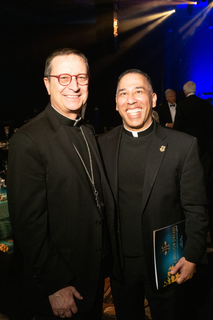 Bishop Italo DellOro, Father Kevin Storey at the UST 75th anniversary gala. (Photo by Daniel Ortiz)
