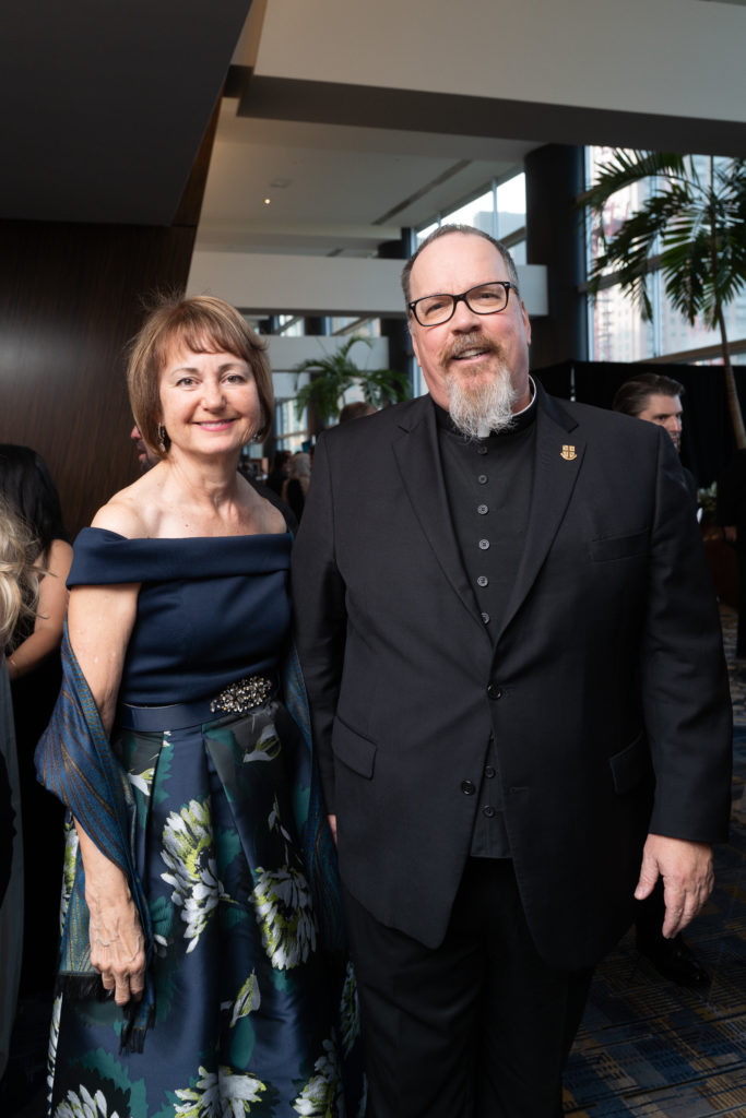 Michele Malloy and Father Sean Horrigan at the UST 75th anniversary gala. (Photo by Daniel Ortiz)