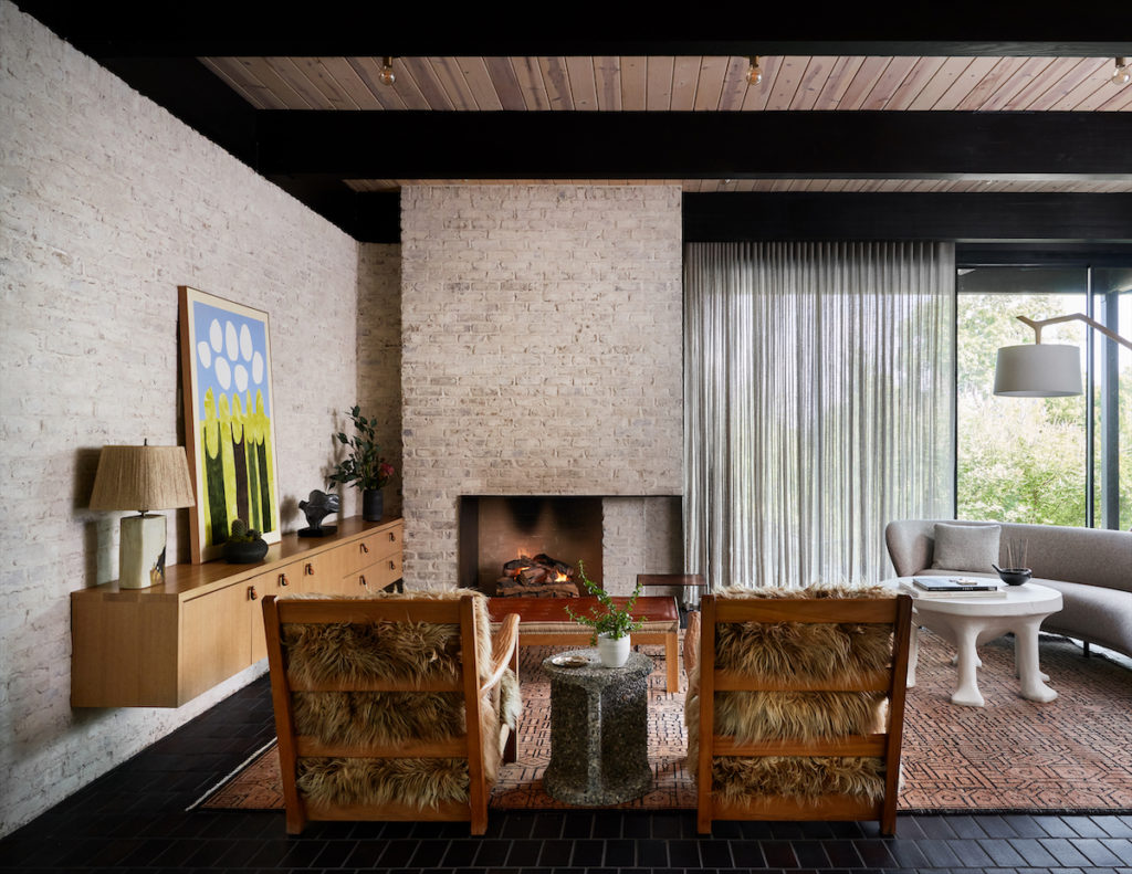 The living room’s antique French lounge chairs from 20cdesign are upholstered in Mongolian fur. Vintage John Dickinson footed plaster table. Rug from Commune Design, Los Angeles. Side table by Jeff Martin Joinery, Vancouver. Straight Thread Chair Co. bench. Custom cabinet by Joshua Rice. Massproductions sofa, Sweden. (Photo by Stephen Karlisch and Robert Tsai)